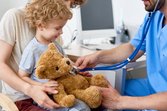 Doctor playing with small child