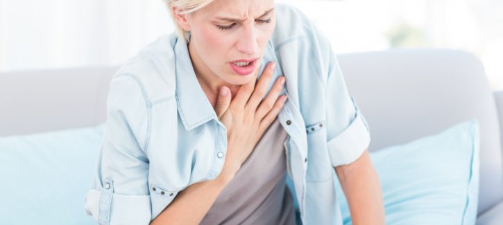 Woman having difficulty breathing