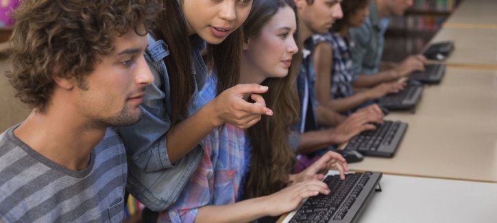 Teenagers working on computers